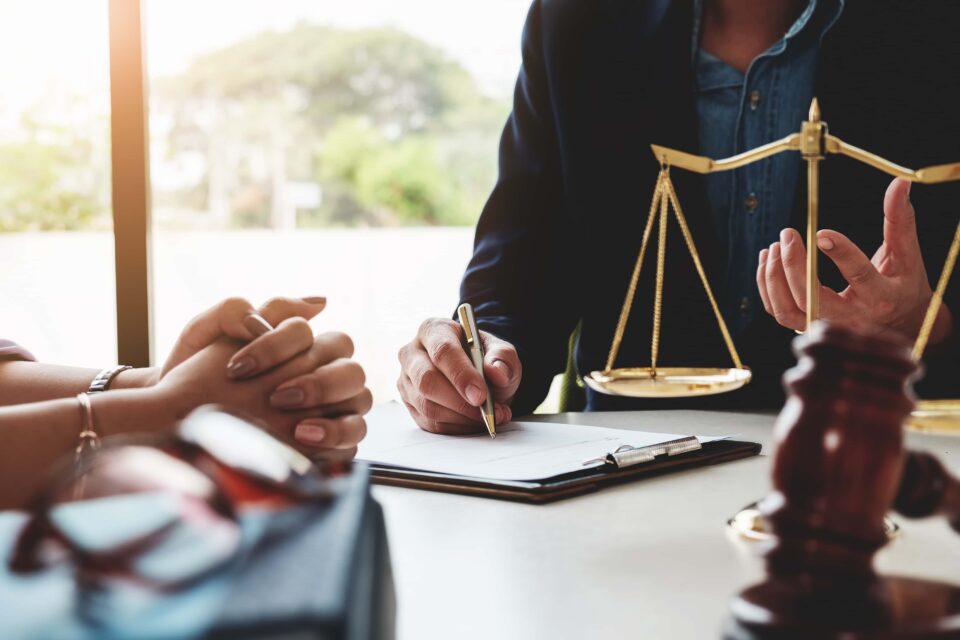 An attorney from Hudson Family Law is discussing case details with a client in Palm Beach County, FL