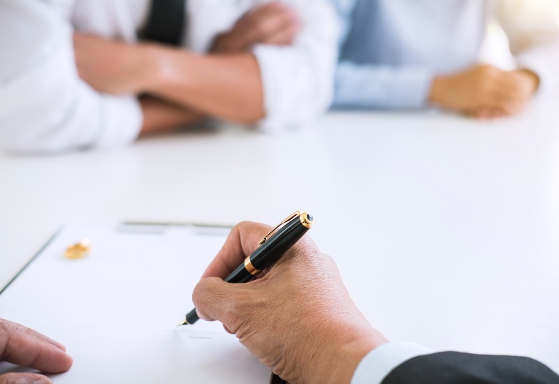 A couple is meeting a divorce lawyer from Hudson Family Law in Palm Beach County, FL